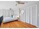 A bright, lofted bedroom features an overhead fan and hardwood floors at 2 Francis St # I, Charleston, SC 29403