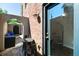 Cozy outdoor courtyard with stone tiles, a brick wall, and comfortable seating at 2 Francis St # I, Charleston, SC 29403