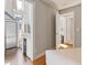 The home's kitchen area leads to the stairs and other areas in this light and airy property at 2 Francis St # I, Charleston, SC 29403