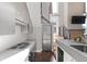This home's light and airy kitchen features stainless appliances and grey countertops and cabinetry at 2 Francis St # I, Charleston, SC 29403