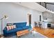Inviting living room with a modern couch, open floor plan, and lots of light at 2 Francis St # I, Charleston, SC 29403