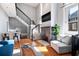 Bright living room with hardwood floors, a fireplace, and neutral decor at 2 Francis St # I, Charleston, SC 29403