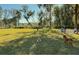 Dog park with grassy areas, playful dogs, and people enjoying outdoor recreation in a community setting at 2056 Ten Point Dr, Charleston, SC 29492