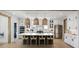 Bright, open kitchen with large island, marble countertops, stainless appliances, and stylish pendant lighting at 2056 Ten Point Dr, Charleston, SC 29492
