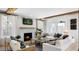 Cozy living room featuring a fireplace, wood beams, and comfortable seating, perfect for relaxation and entertaining at 2056 Ten Point Dr, Charleston, SC 29492