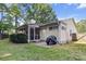 Charming home featuring a screened porch and patio area in the backyard for outdoor entertaining at 210 Basswood Ave, Summerville, SC 29483