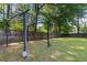 Large, grassy backyard with trellis, perfect for outdoor activities and entertaining at 210 Basswood Ave, Summerville, SC 29483