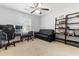 Bright bedroom with a ceiling fan, couch, and a desk offering a comfortable and functional space at 210 Basswood Ave, Summerville, SC 29483
