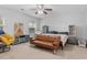 Bedroom with a ceiling fan, neutral carpet, a bed, sofa, and large window for natural light at 210 Basswood Ave, Summerville, SC 29483