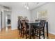 Stylish dining area featuring modern light fixtures, hardwood floors, and bright window at 210 Basswood Ave, Summerville, SC 29483