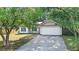 Lovely home featuring a cozy porch, two-car garage, and an inviting driveway at 210 Basswood Ave, Summerville, SC 29483