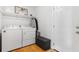 Clean, bright laundry room featuring a washer, dryer, and storage space at 210 Basswood Ave, Summerville, SC 29483