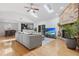 Bright, open living room featuring hardwood floors, fireplace, and seamless transition to kitchen at 210 Basswood Ave, Summerville, SC 29483