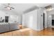 Spacious living room with vaulted ceilings, light gray sofa, and hardwood floors, perfect for entertaining at 210 Basswood Ave, Summerville, SC 29483