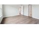 A view of a new bedroom with wood-look floors and an open door at 211 Yalton St, Summerville, SC 29486