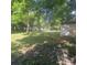 Large backyard with mature trees offering ample space and potential at 214 Winter St, Moncks Corner, SC 29461