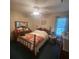A cozy bedroom featuring a wooden bed frame and bright natural light from the window, creating a serene atmosphere at 214 Winter St, Moncks Corner, SC 29461