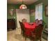 Cozy dining room featuring a wood table with seating for six, illuminated by a colorful Tiffany-style chandelier at 214 Winter St, Moncks Corner, SC 29461