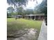 Wide shot of a brick home showcasing its lawn and exterior at 214 Winter St, Moncks Corner, SC 29461