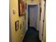 This cozy hallway has a wall with artwork and lighting for a comfortable and stylish passage in the home at 214 Winter St, Moncks Corner, SC 29461