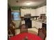 Functional kitchen with white cabinets and black appliances, offering ample storage and cooking space at 214 Winter St, Moncks Corner, SC 29461