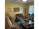 Bright living room with comfortable furnishings and a glass-top coffee table at 214 Winter St, Moncks Corner, SC 29461