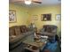 Cozy living room with comfortable seating, decorative accents, and bright yellow walls at 214 Winter St, Moncks Corner, SC 29461