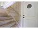 Stairwell featuring an exterior entrance with a distinctive nautical-themed porthole window on the door at 2180 Wappoo Hall Rd, Charleston, SC 29412