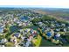 Expansive aerial shot showcases a lakeside community near marshland with beautiful homes nestled among lush trees at 2206 Magnolia Meadows Dr, Mount Pleasant, SC 29464