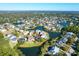 Stunning aerial view of a lakeside community with mature trees and well-maintained homes and green space at 2206 Magnolia Meadows Dr, Mount Pleasant, SC 29464