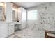 Primary bathroom with a double vanity, marble tile and a glass enclosed shower at 2206 Magnolia Meadows Dr, Mount Pleasant, SC 29464