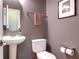 Contemporary half-bathroom featuring pedestal sink and modern fixtures at 2206 Magnolia Meadows Dr, Mount Pleasant, SC 29464