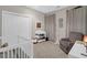 Bedroom featuring a closet, changing table, rocking chair, crib and window with curtains at 2206 Magnolia Meadows Dr, Mount Pleasant, SC 29464