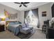 Bedroom featuring a light fixture, window with curtains, bed and upholstered chairs at 2206 Magnolia Meadows Dr, Mount Pleasant, SC 29464