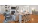 Inviting living room with a fireplace, built-in shelving, hardwood floors, and stylish furnishings at 2206 Magnolia Meadows Dr, Mount Pleasant, SC 29464