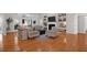 Bright and spacious living room featuring hardwood floors, a fireplace, and lots of windows at 2206 Magnolia Meadows Dr, Mount Pleasant, SC 29464