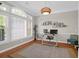 Home office featuring a large window and a stylish desk with decorative shelves and light fixture at 2206 Magnolia Meadows Dr, Mount Pleasant, SC 29464
