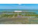 Aerial view of 221 E Mariners Cay waterfront community with tennis courts and marsh views at 221 E Mariners Cay # 221, Folly Beach, SC 29439