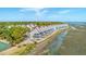 Scenic aerial view of waterfront townhomes by marsh with community tennis court at 221 E Mariners Cay # 221, Folly Beach, SC 29439