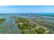 Beautiful aerial view of waterfront community with lush trees and access to marsh and ocean at 221 E Mariners Cay # 221, Folly Beach, SC 29439