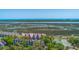 Inviting condo community with lush landscaping, tennis courts, and scenic waterfront views at 221 E Mariners Cay # 221, Folly Beach, SC 29439