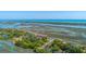 Scenic condo community with waterways, tennis courts, and mature trees in a coastal setting at 221 E Mariners Cay # 221, Folly Beach, SC 29439