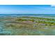 Panoramic aerial view of community with waterfront access, marsh views, and natural surroundings at 221 E Mariners Cay # 221, Folly Beach, SC 29439
