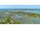 Beautiful aerial showcase of waterfront houses with personal docks along tranquil waterways, connected to the open water at 221 E Mariners Cay # 221, Folly Beach, SC 29439