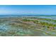Stunning aerial view showcases community with waterfront living and scenic marshland landscapes at 221 E Mariners Cay # 221, Folly Beach, SC 29439
