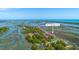 Stunning aerial view of 221 E Mariners Cay, nestled among lush greenery with scenic water views, offering a serene coastal lifestyle at 221 E Mariners Cay # 221, Folly Beach, SC 29439
