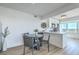 Dining area features modern furnishings, ample natural light, and seamless access to the kitchen at 221 E Mariners Cay # 221, Folly Beach, SC 29439