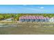 Beautiful exterior of waterfront townhomes near community tennis court, offering stunning marsh views at 221 E Mariners Cay # 221, Folly Beach, SC 29439
