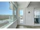 Hallway featuring view of marsh and partial view of balcony at 221 E Mariners Cay # 221, Folly Beach, SC 29439