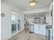 Well-lit kitchen showcases modern appliances and direct access to the outdoor patio area at 221 E Mariners Cay # 221, Folly Beach, SC 29439